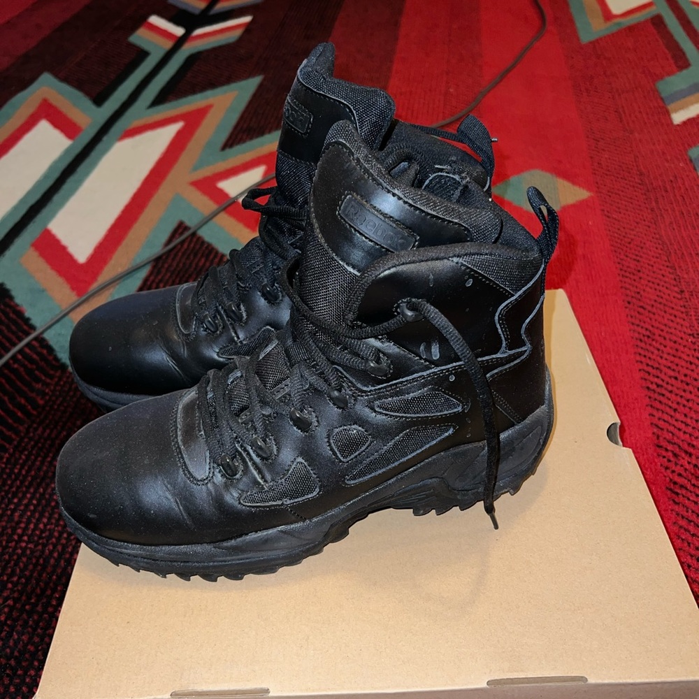 Slightly worn Reebok work boots.